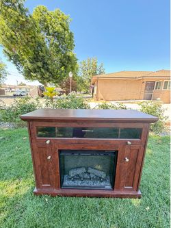 125$$$ FREE DELIVERY TV stand with fireplace electric everything works like new