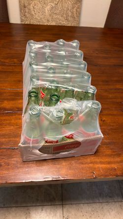 Box of empty Coke bottles