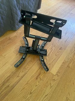 Adjustable TV Bracket holds up to 65 inches