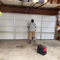 Garage Door Spring Adjustment And  Replace 