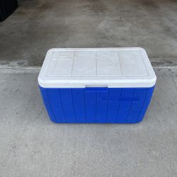 Coleman 48-quart blue chest cooler.  Capacity: Holds up to 76 cans.  Insulation: Keeps ice up to 3 days in temperatures up to 90°F.  Features: Include