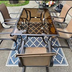 Beautiful outdoor dinning table with rocking chairs 