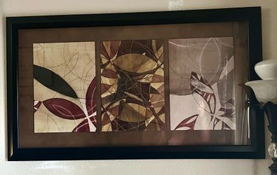 3-panel modern abstract triptych framed under glass; the artwork features an interlocking floral & geometric pattern layered with shades of burgundy,