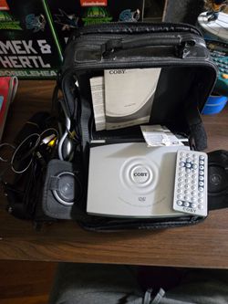 Coby Portable DVD Player Includes  remote and carrying case.