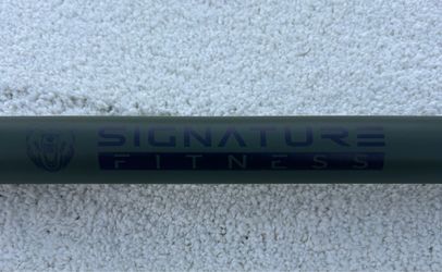 New 7 foot military green Olympic bar weight 45 pounds capacity 1500 pounds