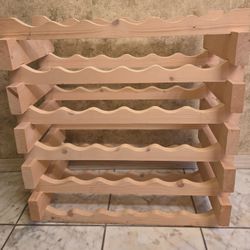 Sturdy wooden wine rack with multiple shelves. Holds 36 botles