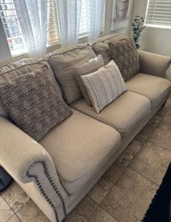 2 beige couches