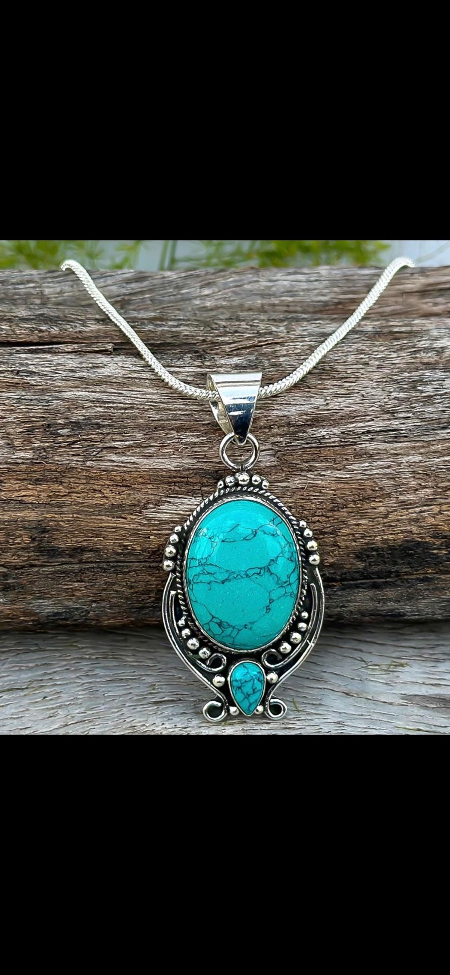 Simulated Turquoise Sterling Silver Pendant Necklace: Oval pendant with intricate silver work. Includes the Silver Chain.
