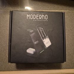 3-in-1 wireless charging station by Moderno Collections designed to charge a phone, earbuds, and a smartwatch simultaneously.