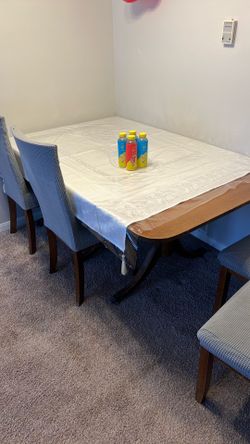 a huge table and 4 chairs