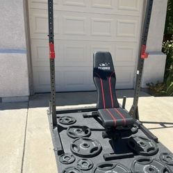 Very nice weight bench and squat rack. $300
Olympic weight plates sold separately. 

Lots Of Olympic Weights Available. 45s, 35s, 25s, 10s, 5s 