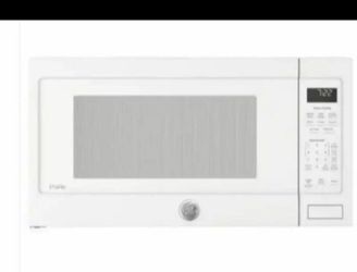 MICROWAVE OVEN/ FOUR À MICRO-ONDES/ HORNO MICROONDAS SIDE / CÔTÉ/LADO MAX CLAMP PRESSURE = 1700 lbs. BULK CLAMPING ONLY Product Dimensions: 14"H x