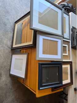 Various wall and desk picture frames