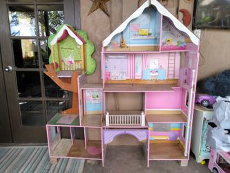 A wood Barbie playhouse
