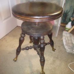 ANTIQUE CLAW AND BALL SWIVEL PIANO STOOL

