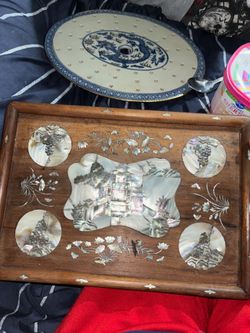 This is a 19th-century Chinese export porcelain "mazarin" or strainer platter, featuring a blue and white dragon design with drainage holes.