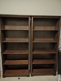 2 wood Ikea bookshelves
