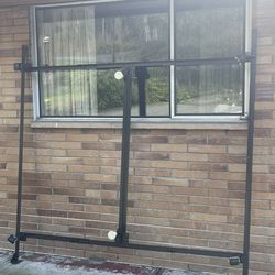 King sized M1etal Bed Frame adjustable with wheels.