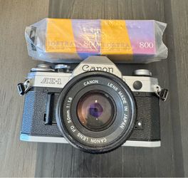 Vintage Canon AE-1 35mm SLR Film Camera with 800 Film Included