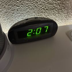 Clock With Alarm And Radio Function 