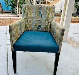Accent chair with wooden legs.