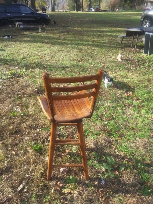 three wooden bar Stools