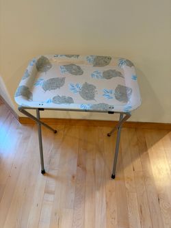 Vintage TV Tray on stand with skeleton leaf and blue sprig.