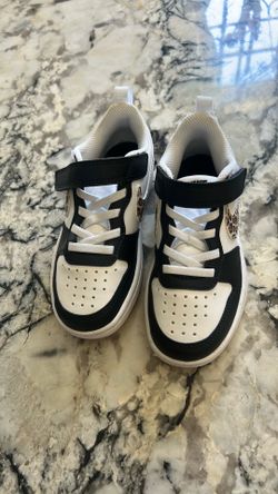 The Nike Court Borough Low toddler sneaker in black and white 10.5C