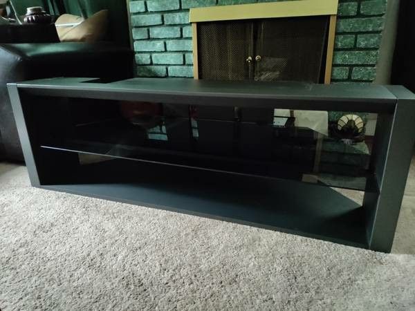 T.V Stand W/ Glass Shelf! Holds up to a 65" T.V! 