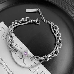 Elegant hand chain made of titanium and steel, luxurious and classic Cuban style, multiple layers, with a zebra pattern on the buckle.