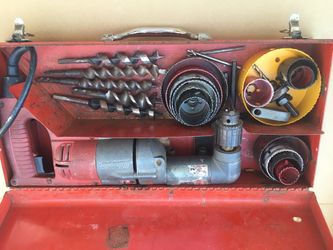 Right angle drill with auger bits and hole saws