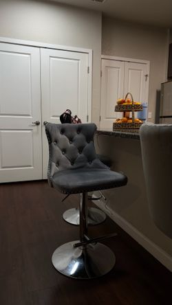 Set of gray velvet adjustable bar stools