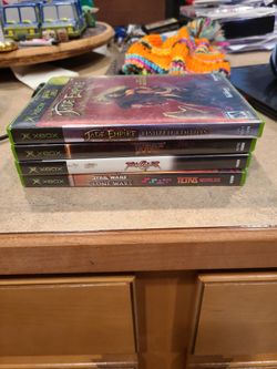 2 Xbox controllers and games