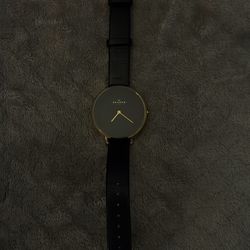 Skagen Ditte watch, model SKW2286, featuring a black dial and a matching black leather strap.