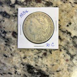 1884 MORGAN SILVER DOLLAR.  (20c)