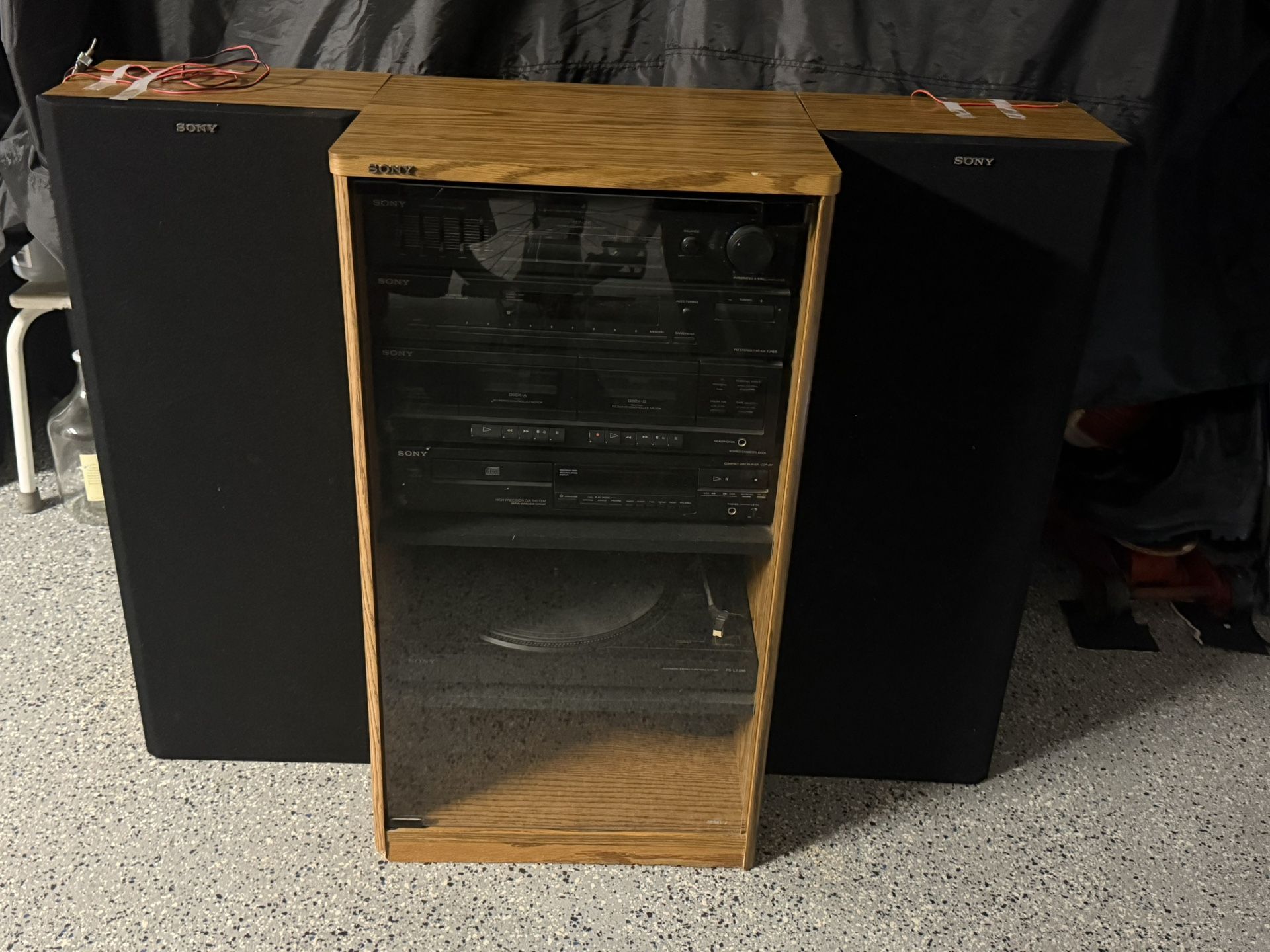 Sony Stereo System, Includes Original Speakers, Record Player, CD And Cassette Player. Some Chipped Areas On Particle Board. Vintage 1980s
