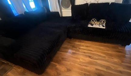 Black fluffy couches