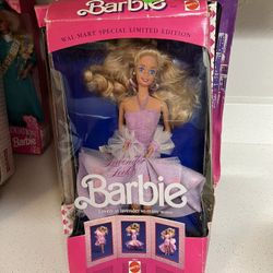 1989 Mattel Lavender Looks Barbie Doll, a Wal-Mart Special Limited Edition.  The doll has blonde, wavy hair and violet eyes. It comes in its original,