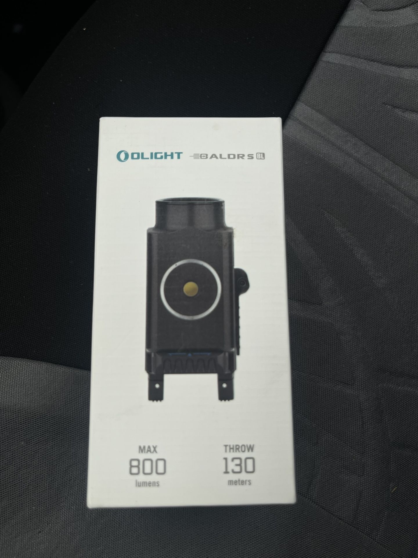 Olight Baldr S BL, a compact rail-mounted tactical light with a blu