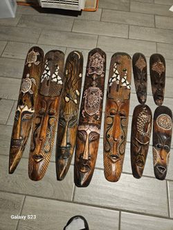 Set of 9 Carved Wooden Tribal Masks