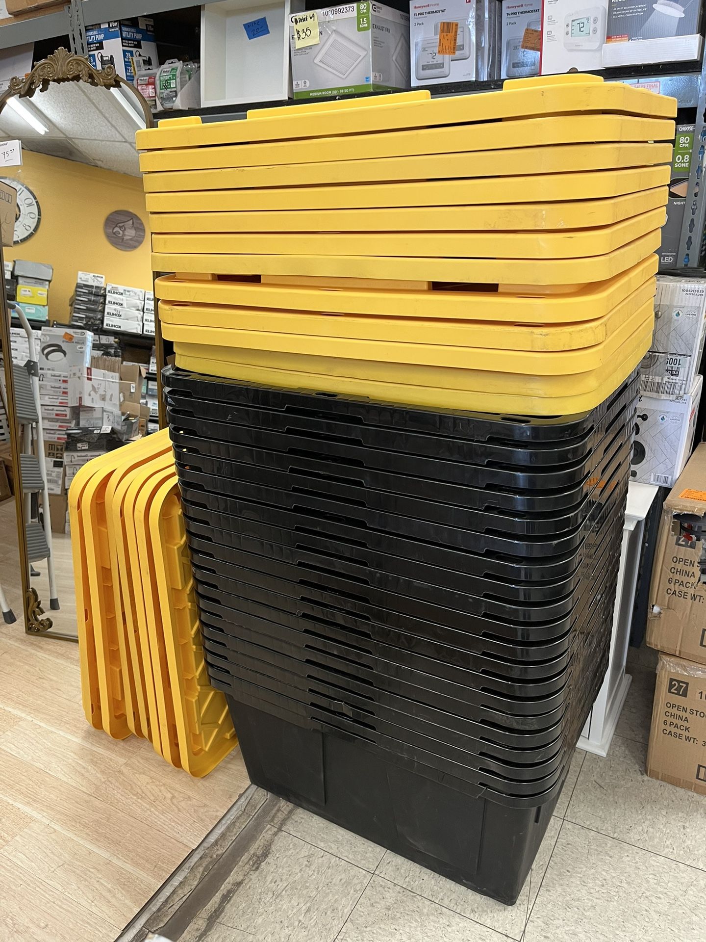 HDX 27 gal. Strong Box Plastic Storage Tote in Black and Yellow for ...