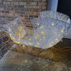 Christmas sleigh lighted is in good condition but is missing a bulb this sleigh is huge 