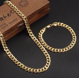 New 18 k yellow gold Cuban link chain and bracelet