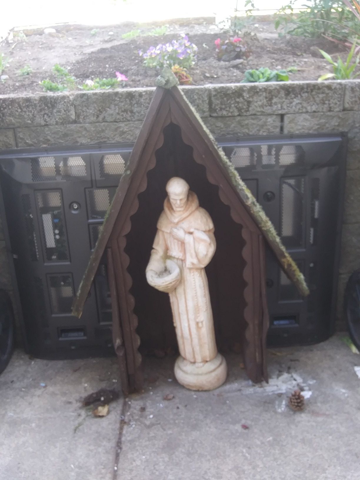 St frances collectable statue and red wood shelter