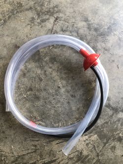 Extreme Max Turbo Siphon, a high-flow fluid transfer system designed for quickly and cleaner moving liquids like fuel. 