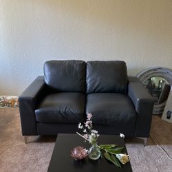 grey leather couch/loveseat 