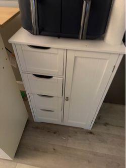 Slim storage cabinet with drawers