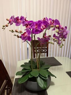 Artificial orchid in a vase.