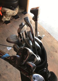 Several golf clubs with bag