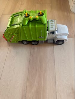 Large toy recycling truck with four-wheel drive, lights, and sounds